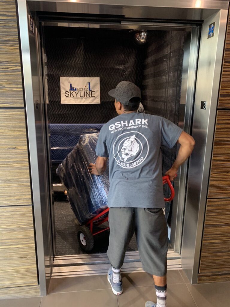 A mover assembling furniture in a new home.