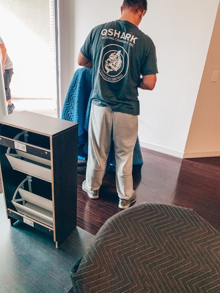professionals preparing furniture to be moved.