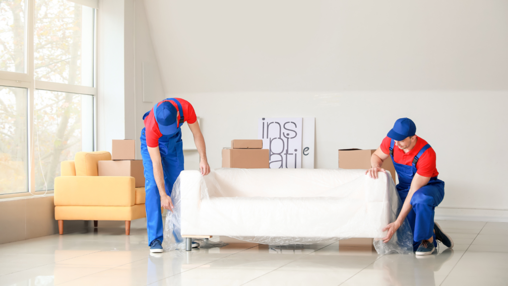 a picture of professional movers moving a couch