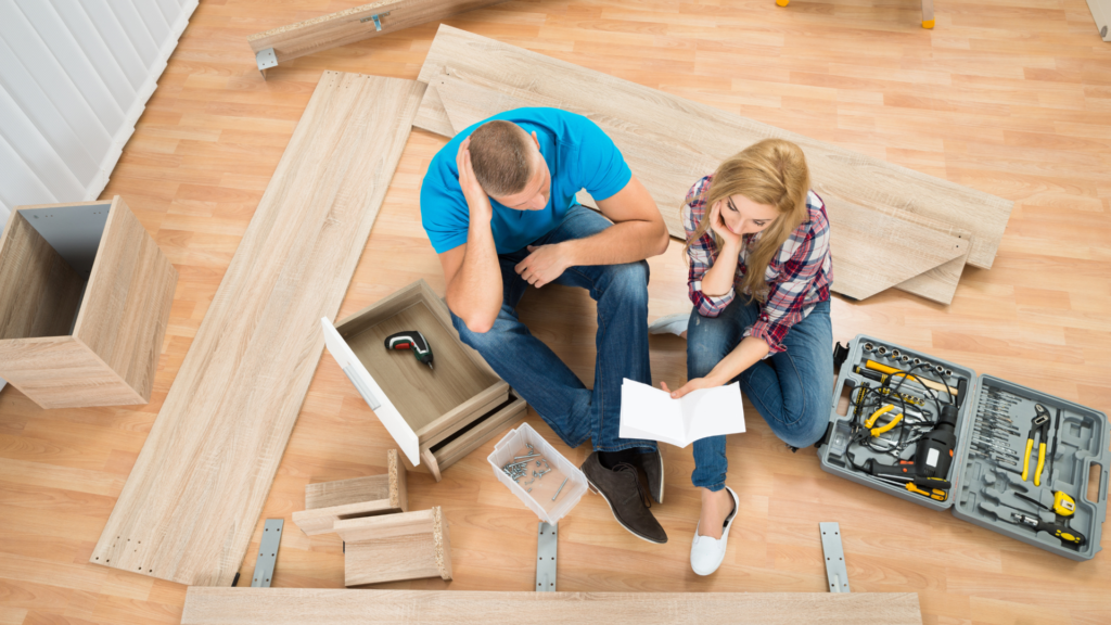 a couple assembling a bed